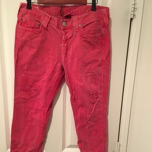 Red ripped True Religion jeans